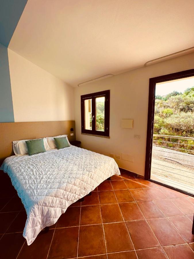 Rocce Rosse Sardinia Aparthotel Isola Rossa Bagian luar foto