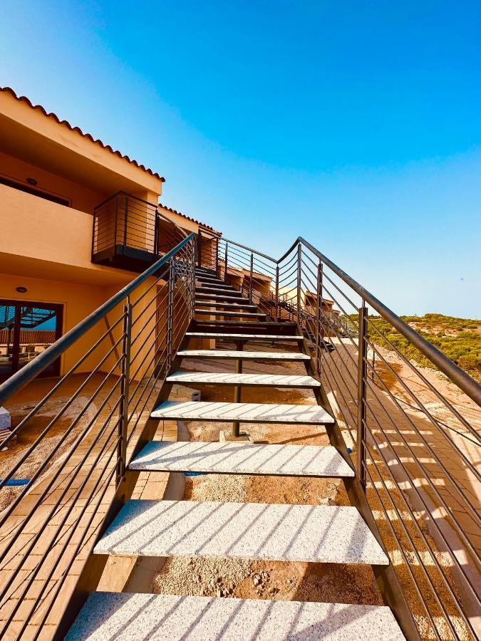 Rocce Rosse Sardinia Aparthotel Isola Rossa Bagian luar foto