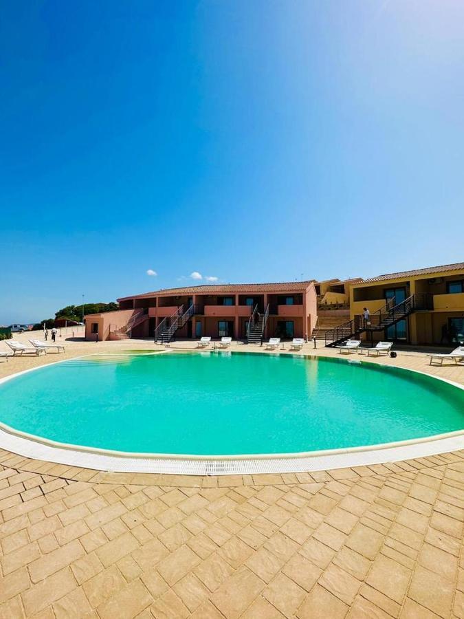 Rocce Rosse Sardinia Aparthotel Isola Rossa Bagian luar foto